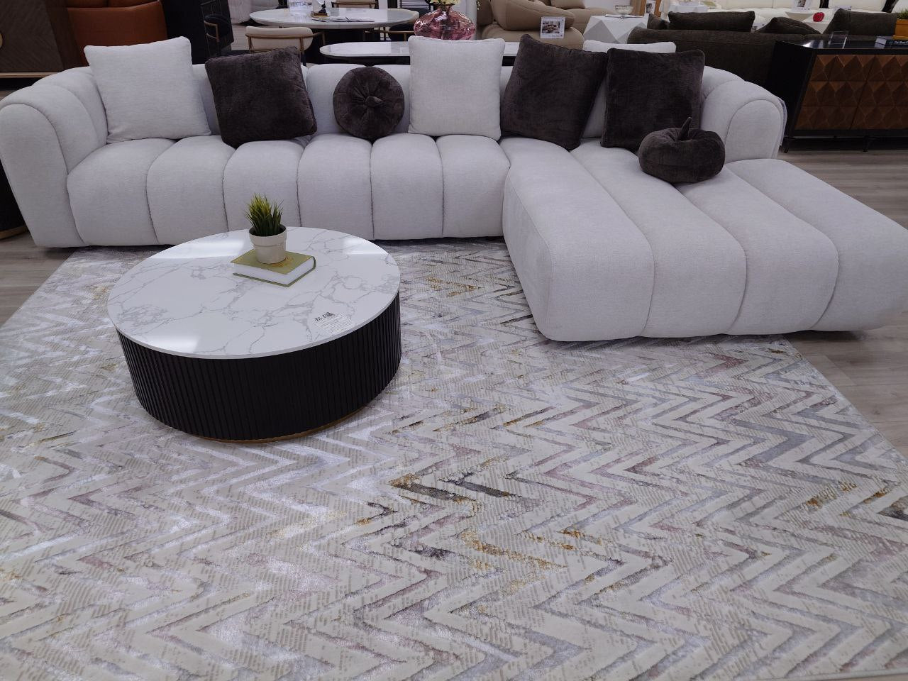 Channel tufted Right facing sectional upholstered in white fabric waccent pillows