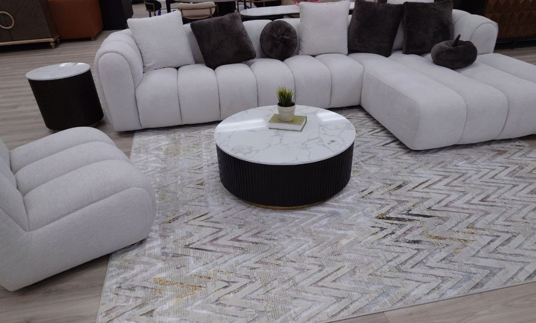 Channel tufted Right facing sectional upholstered in white fabric waccent pillows