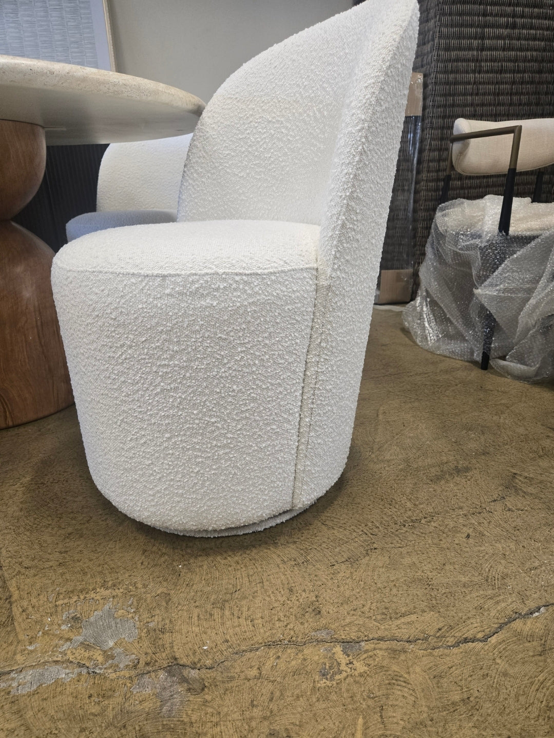 Tete Upholstered Swivel dining chair in ivory performance boucle fabric