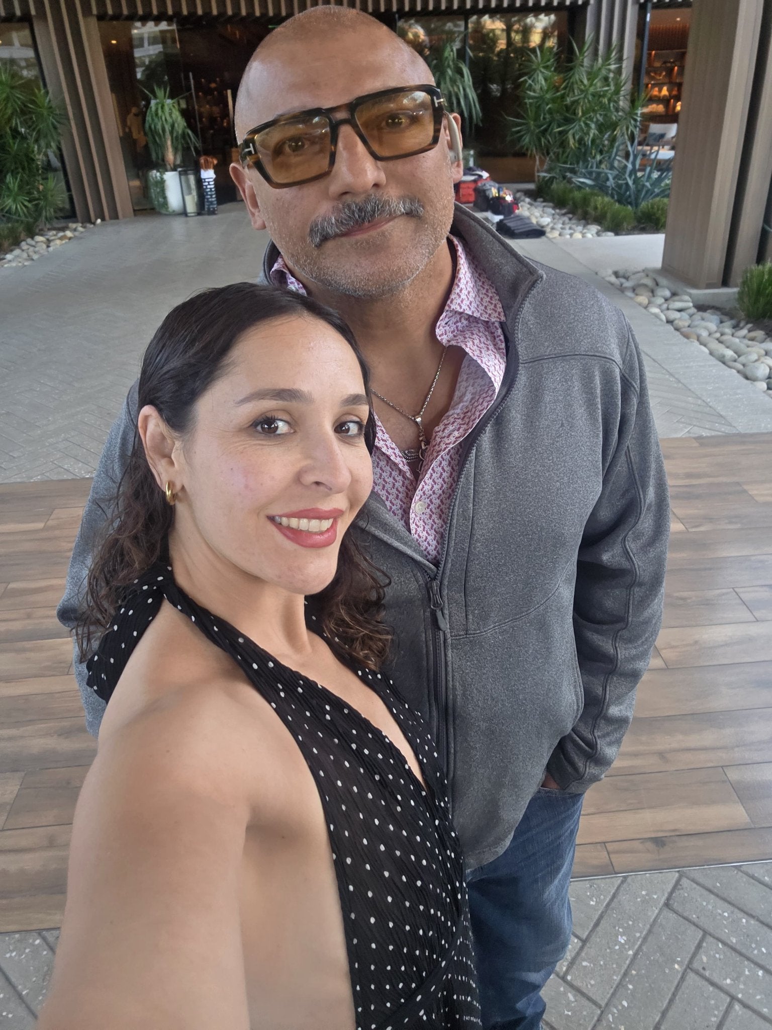JR and Juda selfie at a resort-style entrance